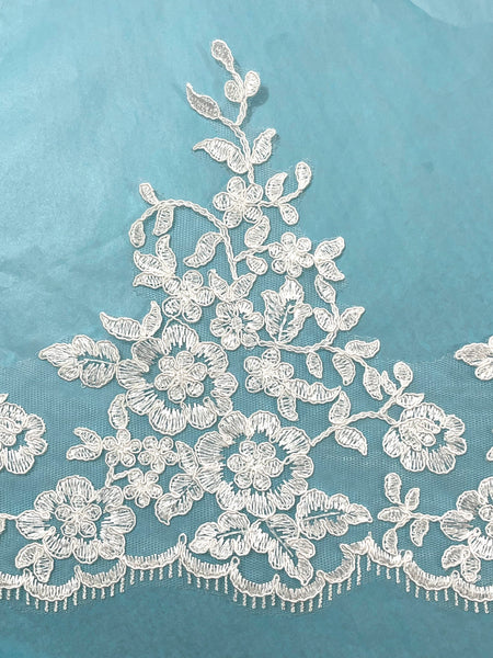 Orilla bordada en Tul Ivory