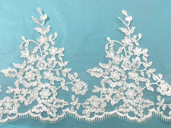 Orilla bordada en Tul Ivory