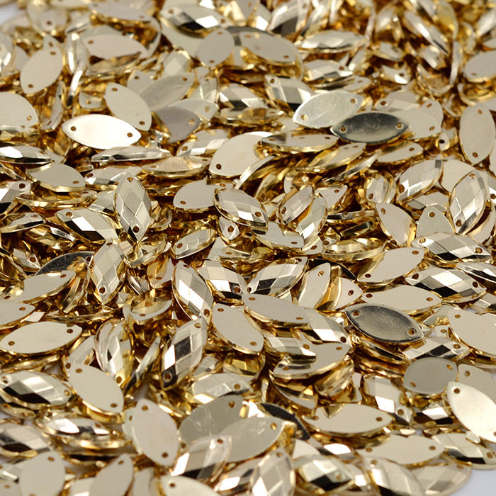 Acrílico Navette Oro Metálico 7x15mm c/100 piezas