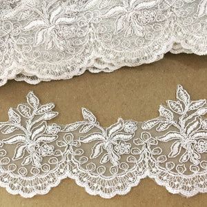Orilla de tul bordada ivory c/plata
